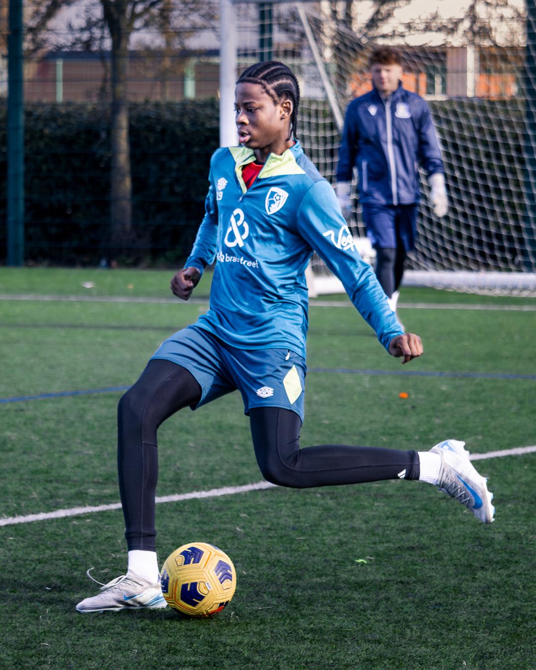 Player driving forward with the ball during the first FixUp Arena tournament at Castle Green, Dagenham