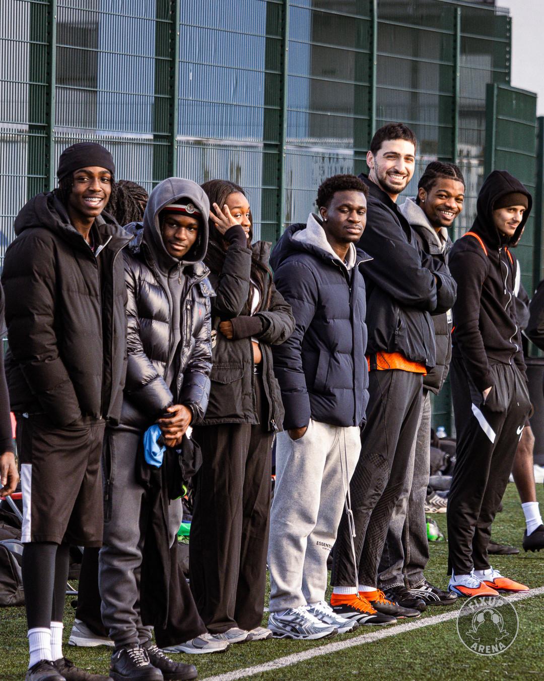 Players and supporters watching from the sideline at the first FixUp Arena tournament
